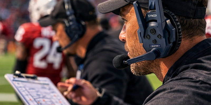 Who are NFL coaches talking to on their headsets?